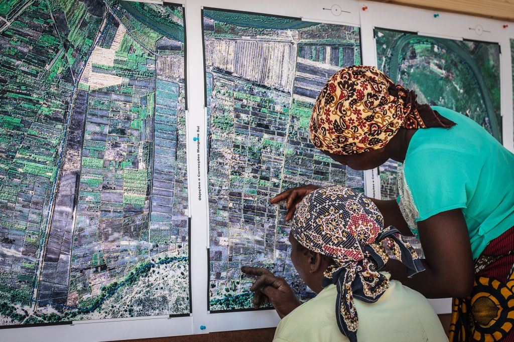 Photo of two women studying a map