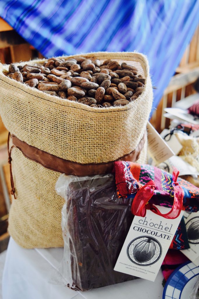 A bag of raw cacao and a chocolate bar