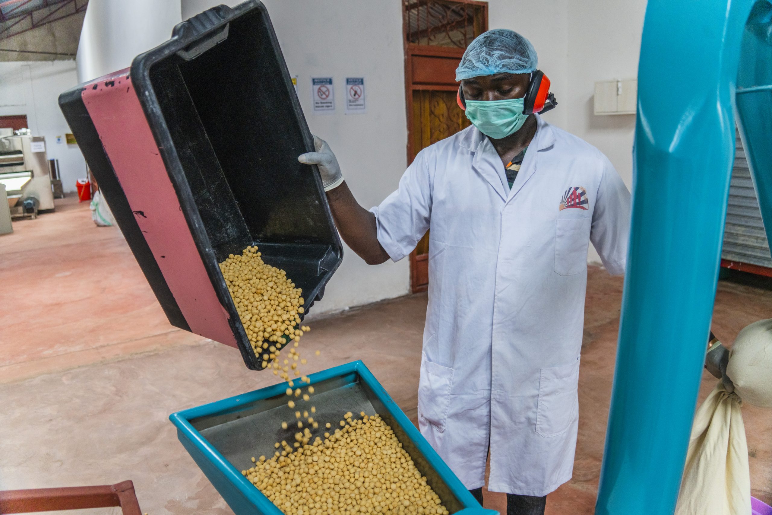 A Rumishael and Daughters Food Co. employee gathers ingredients for instant porridge