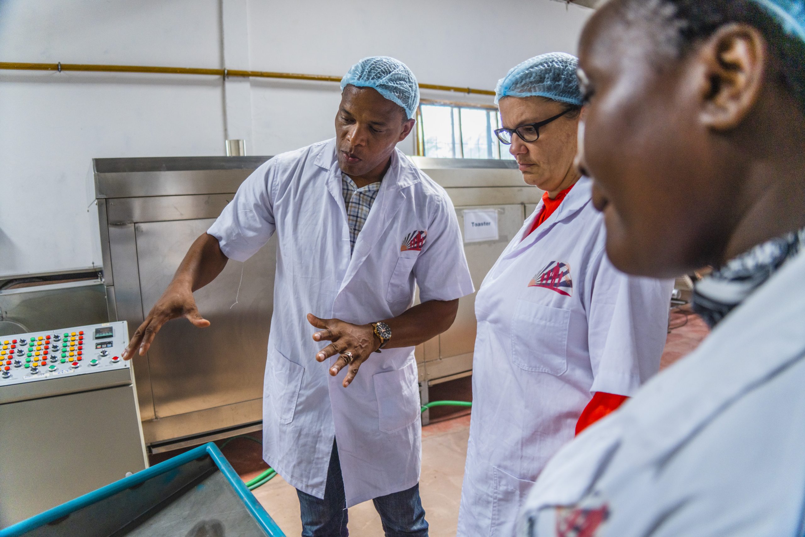 A group of workers at Rumishael and Daughters Food Co. review operations to improve malnourishment in Tanzania.