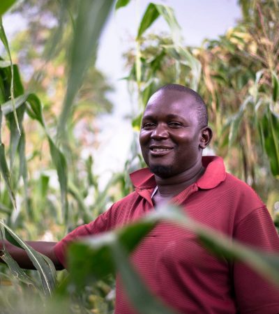 Photo of Kenyan farmer with crops